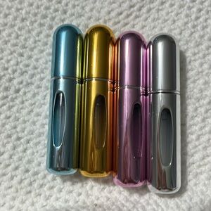 Refillable perfume atomizers